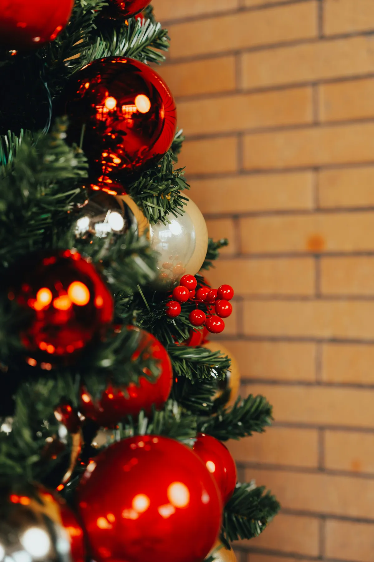 A christmas tree with red and silver ornaments