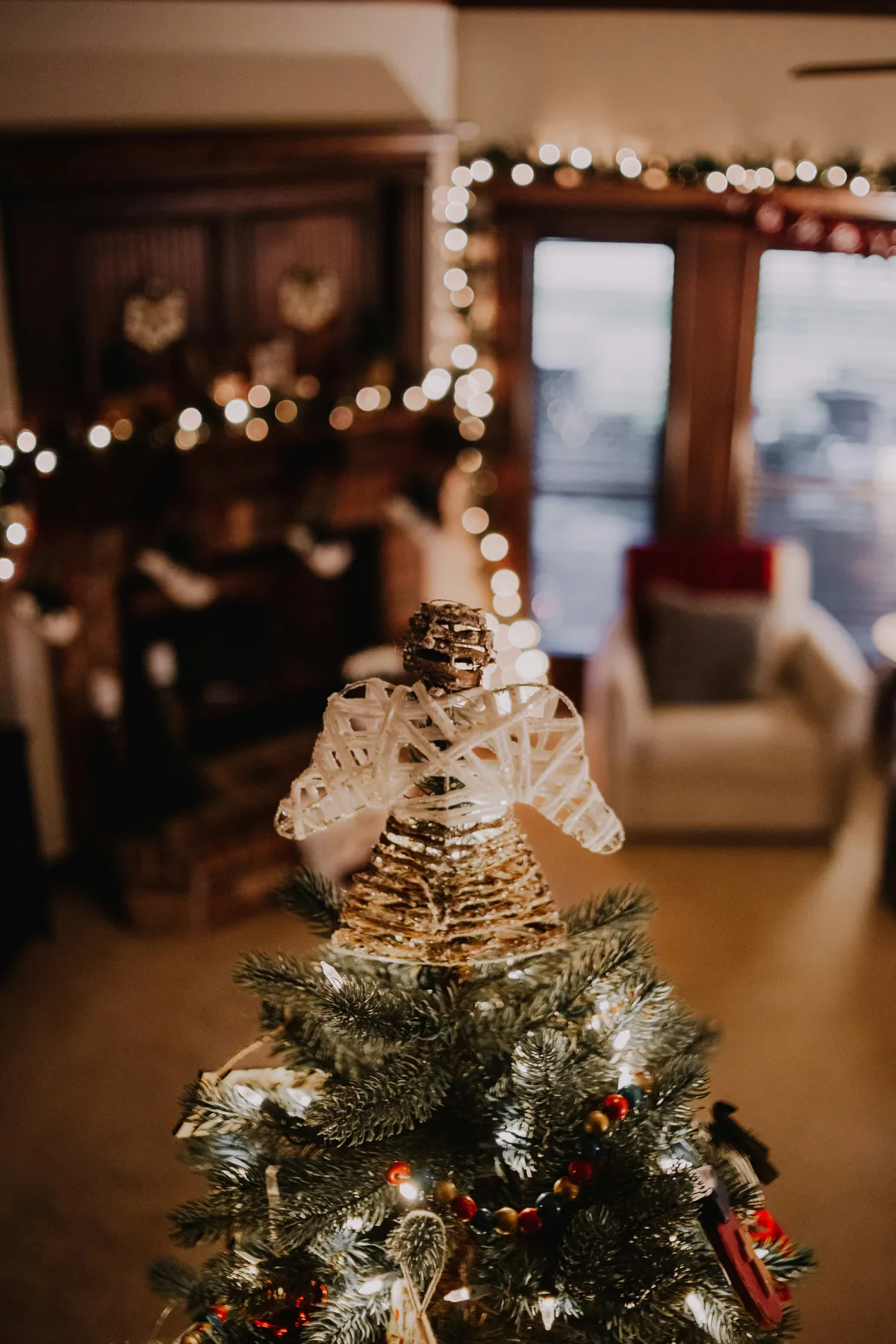 a small christmas tree with lights in a living room
