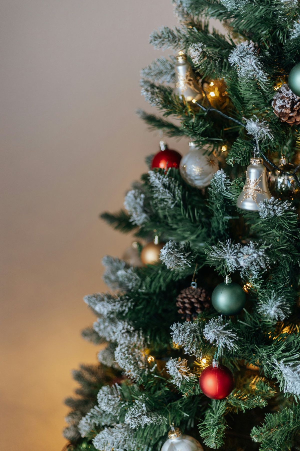 a small christmas tree with ornaments on it