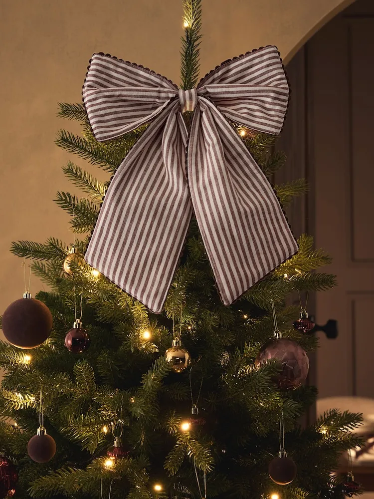 Buy Chocolate Brown Scallop Edge Christmas Bow Tree Topper from Next Jordan