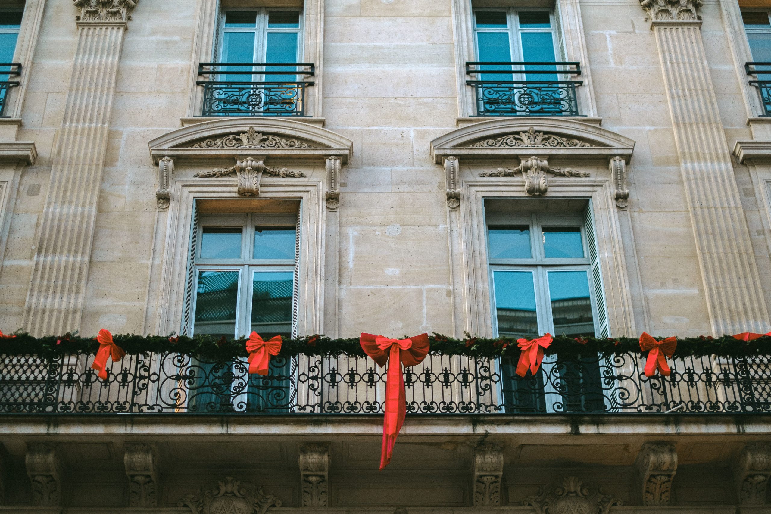 Christmas Decorations on the Balconies of a City Building · Free Stock Photo