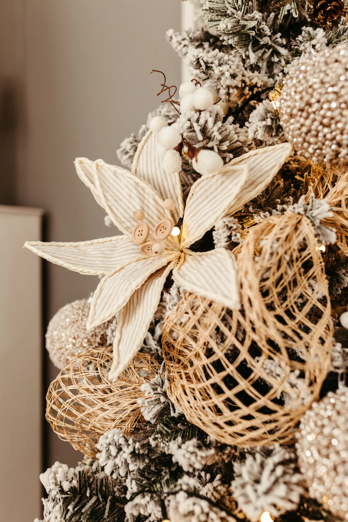 Close-up of a rustic Christmas tree adorned with natural ornaments and festive decorations.