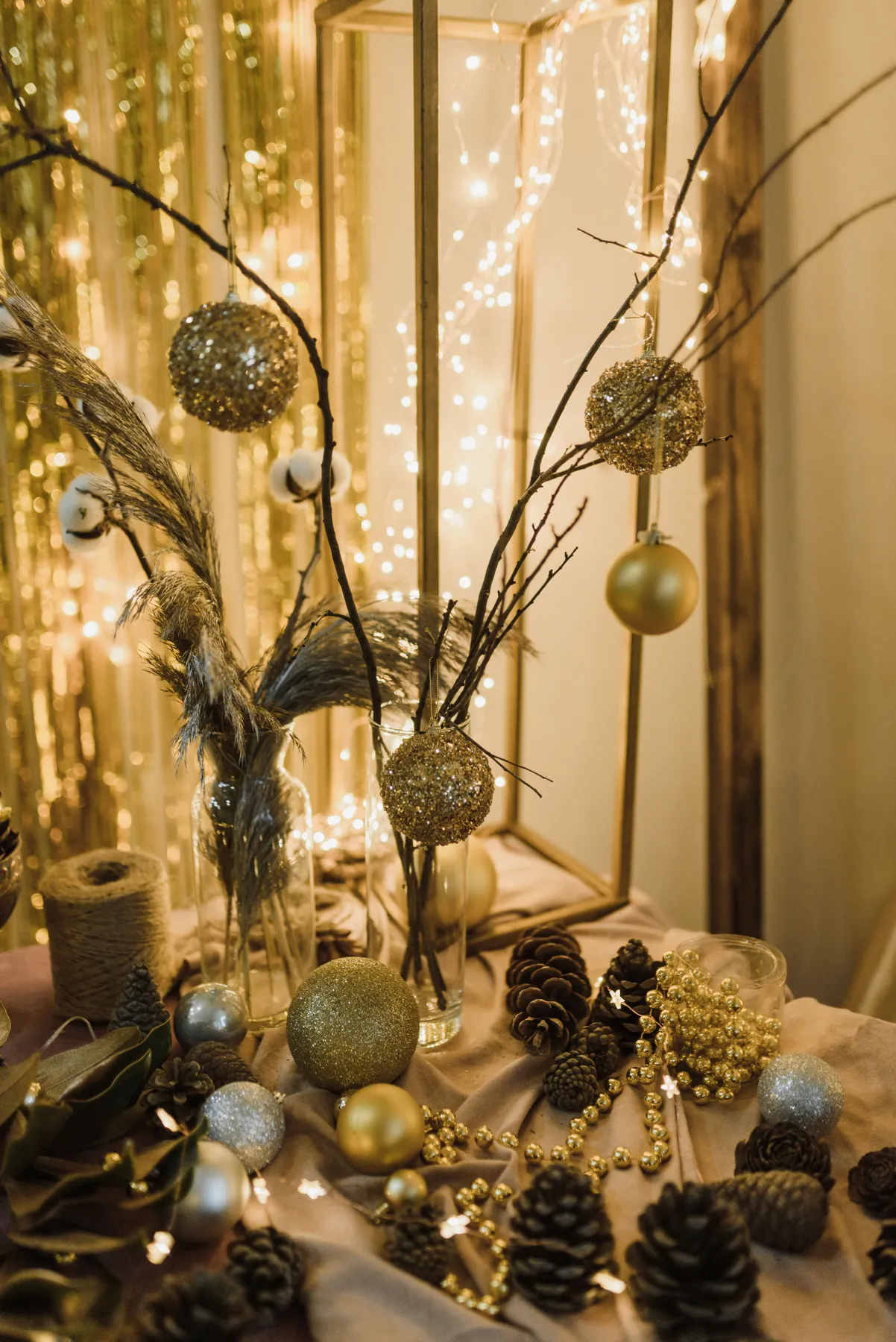 Elegant Christmas decorations with baubles, pine cones, and twigs create a festive atmosphere.