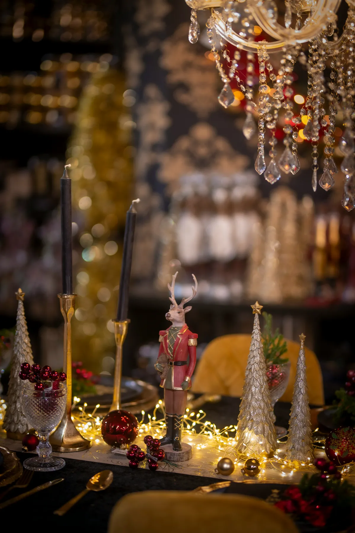 Elegant christmas table setting with nutcracker and lights