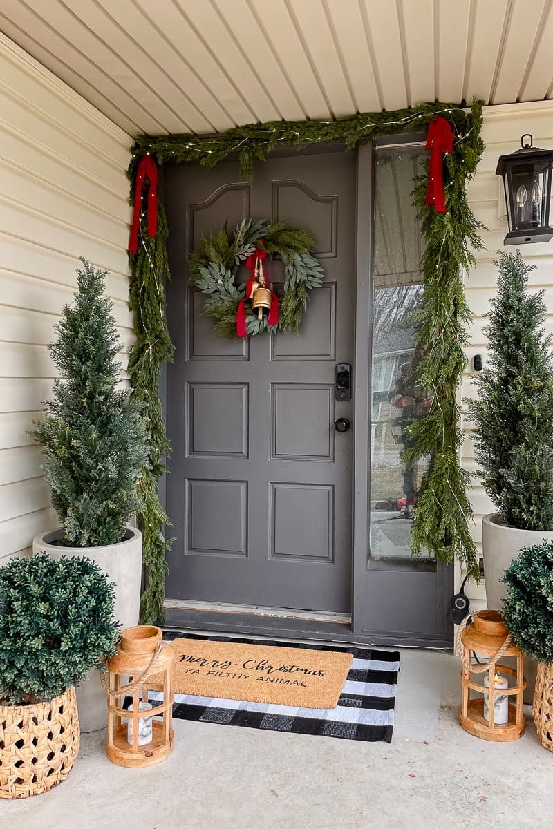 Festive Porch With 3 Types of Greenery and Warm Tones | Crystel Montenegro  Home