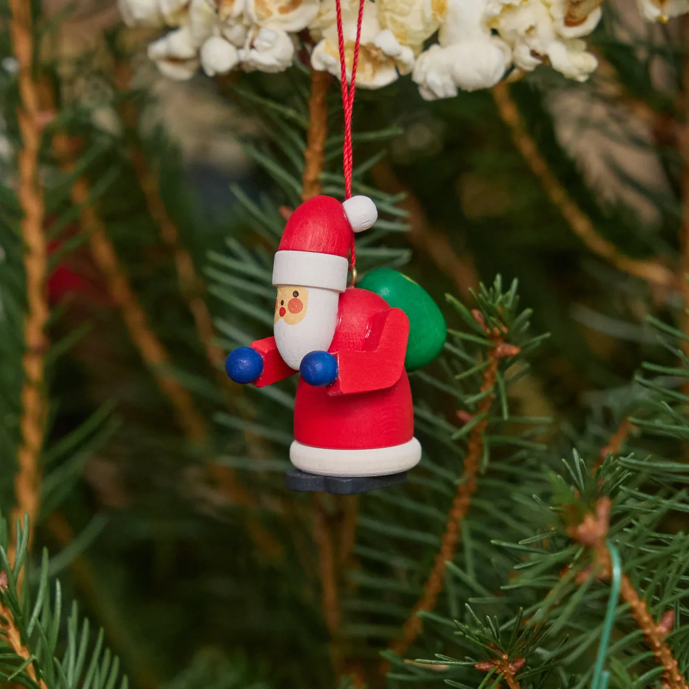Handmade Wooden Red Santa Holding Green Sack on its Back Ornament –  Craftspring