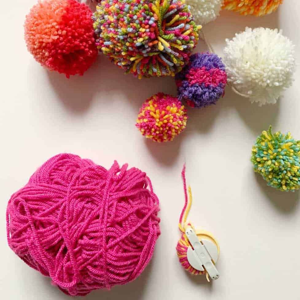 How to make a DIY pom pom blanket by The Listed Home