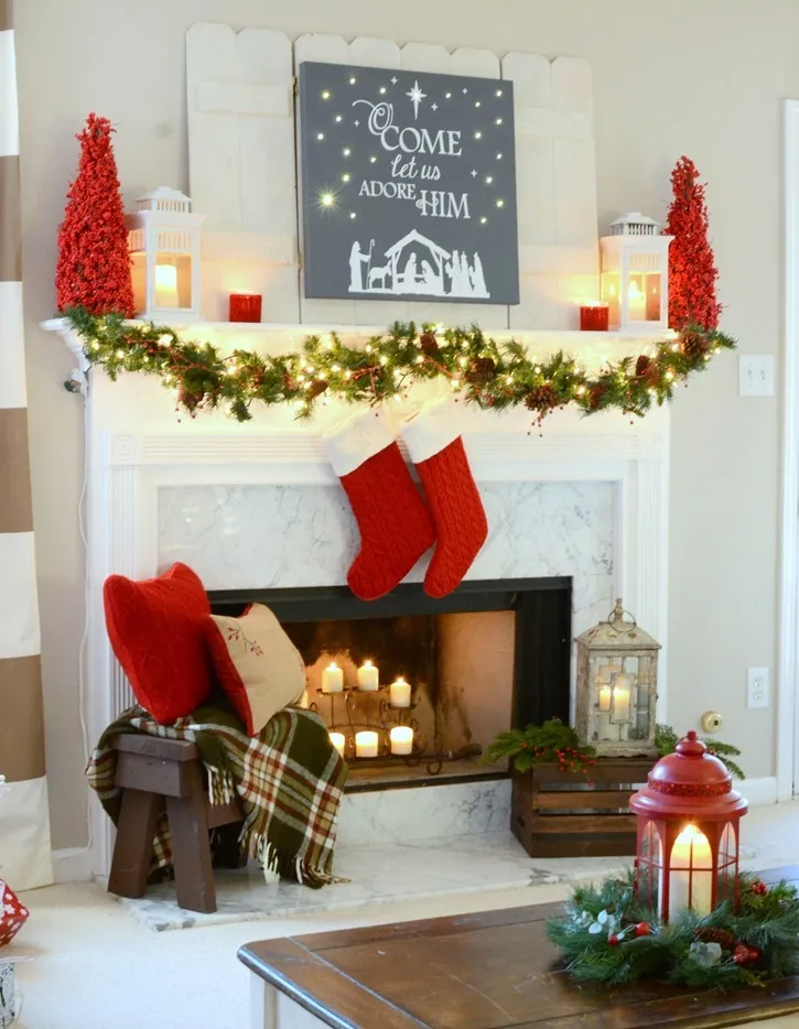 Red and festive Christmas mantel with DIY lit canvas