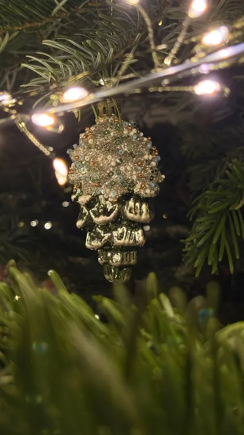 Sparkling Christmas Ornament on Green Tree Branch · Free Stock Photo